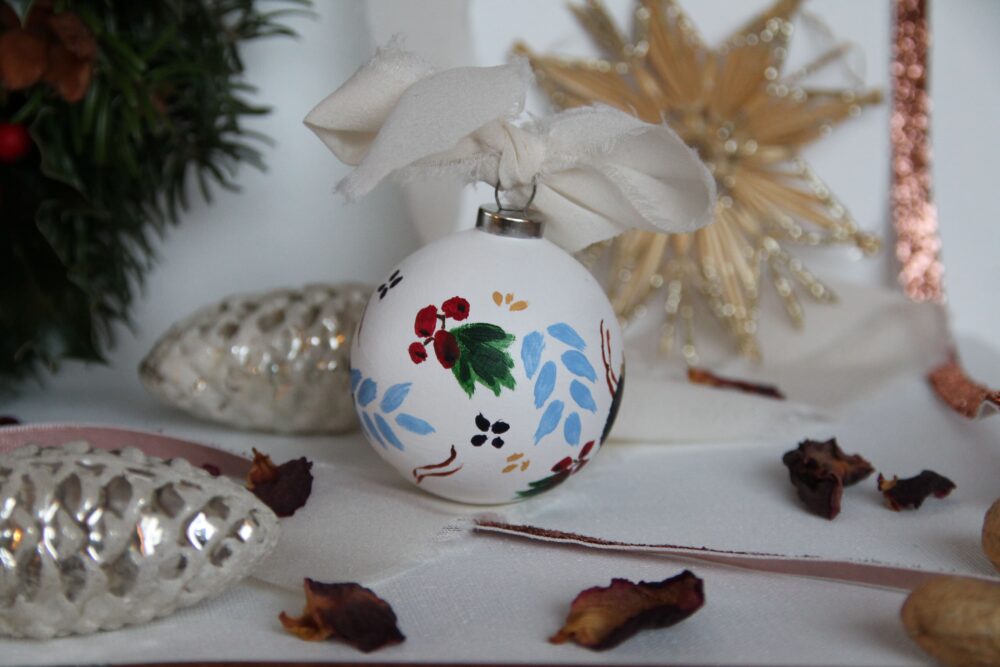 hand-painted ornament with botanical elements