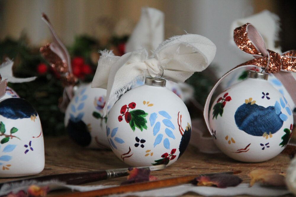 hand-painted christmas ornament with red hawthorn berries