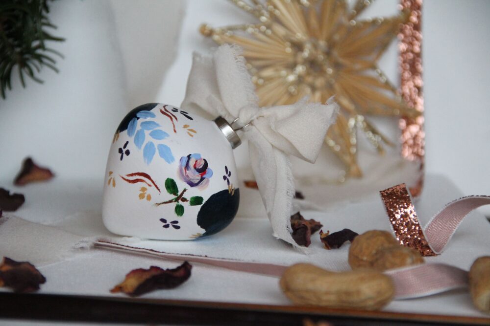 hand-painted ceramic christmas ornament with ribbon